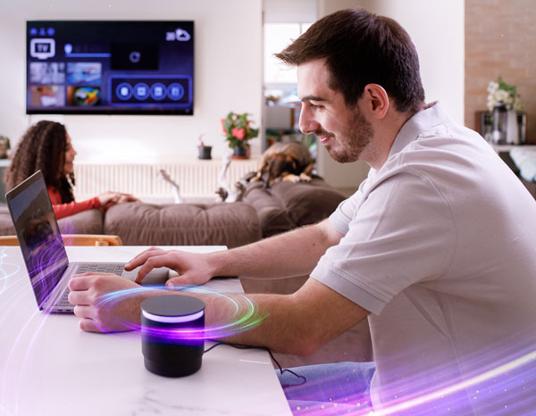 Couple using their valued home electronics.