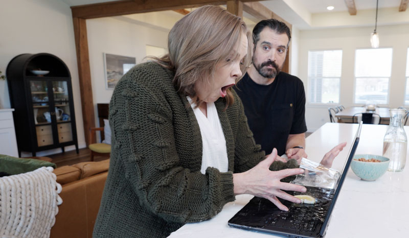 Couple using their valued home electronics.